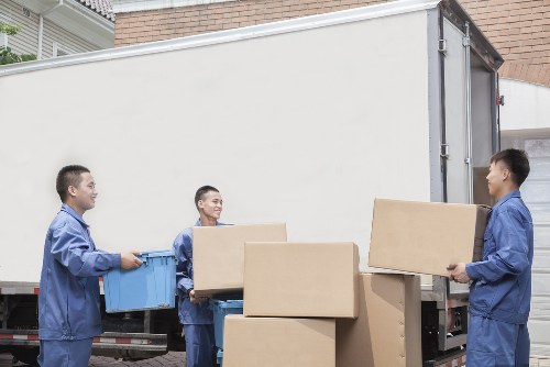 Professional movers carefully handling delicate items