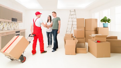 Image of professional movers handling delicate furniture