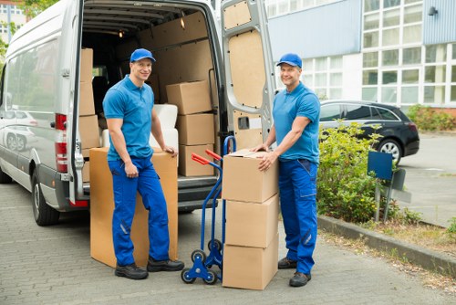 Team expertly packing and loading moving boxes