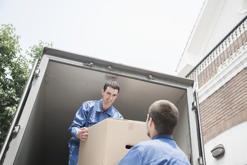 Reliable removal service vehicle driving in St Johns Wood